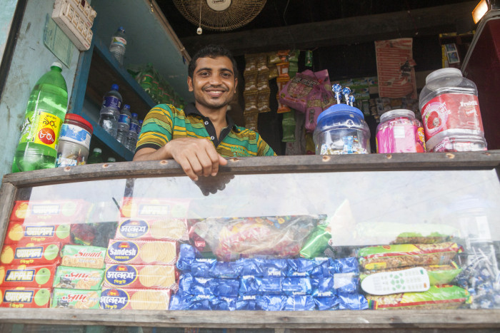 Bangladeshi man working in his shop.